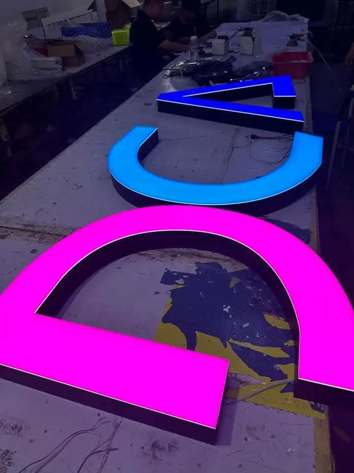 Colour illuminated signage letters under production