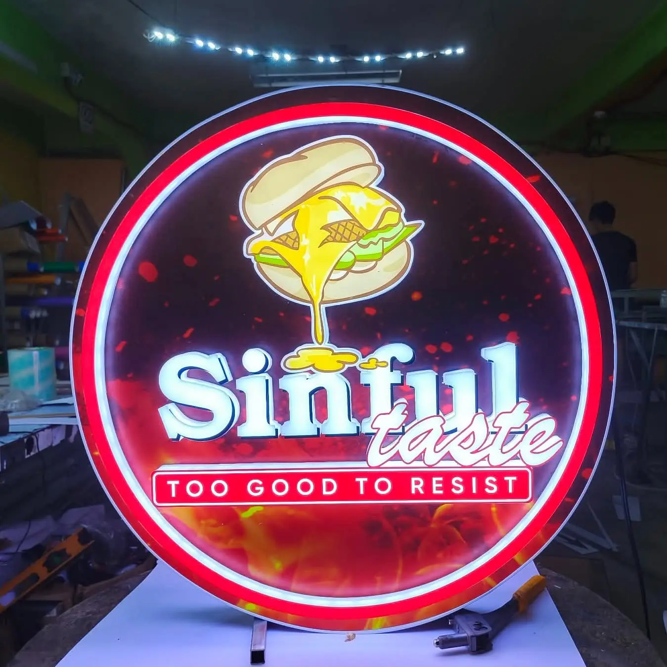 Sinful Taste illuminated round LED sign board