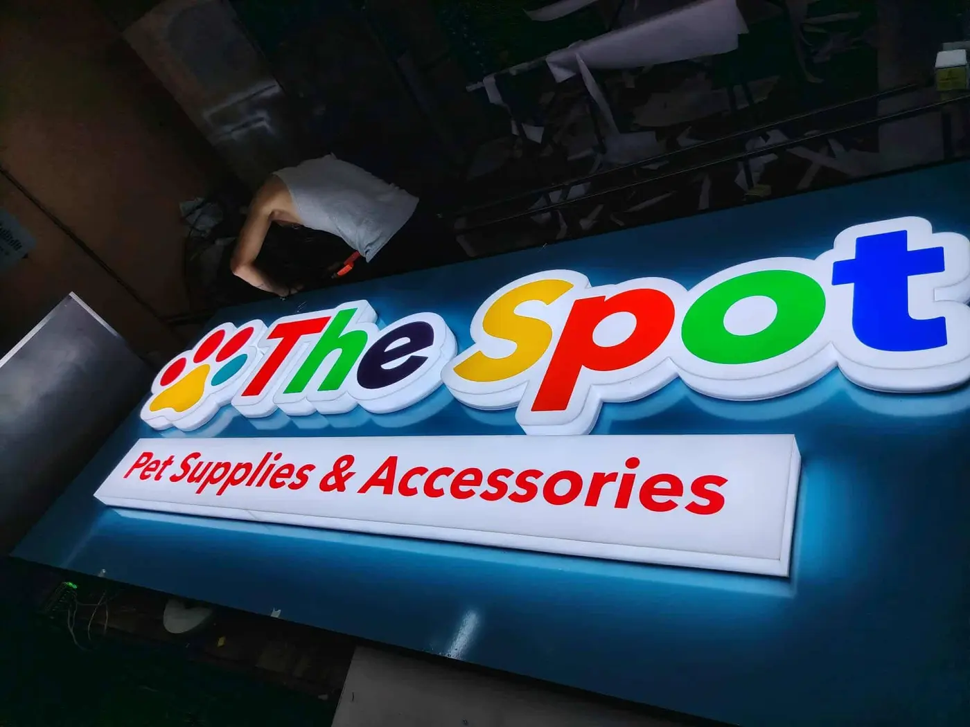 The Spot illuminated shop sign