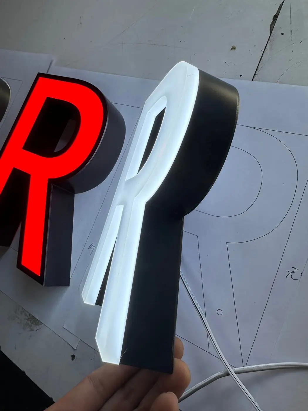 Red and white illuminated channel letter